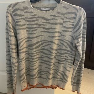 Distressed animal print sweater